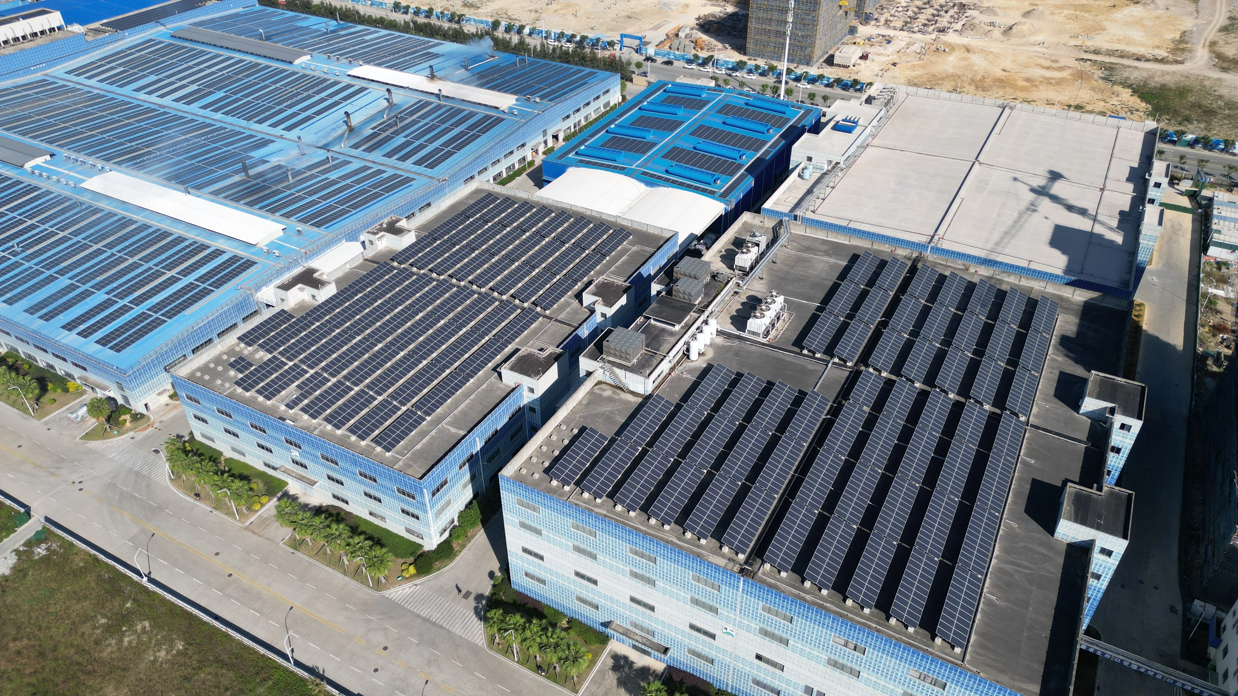 Industrial building complex with rooftop solar panels representing future-oriented development
